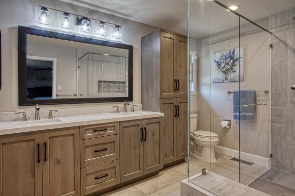 Durasupreme Knotty Alder in twilight. Walk in shower floor tile Akdo mansion 30x30. Wall tile in shower Porcelanosa Nantes Caliza. Countertop Vadara Sereno Bianco. Plumbing Hansgrohe
