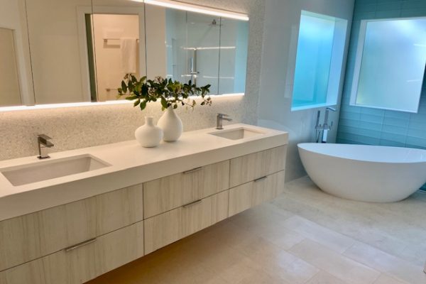Contemporary Modern Bath featuring floating vanity from Bellmont with shell mosaic backsplash.