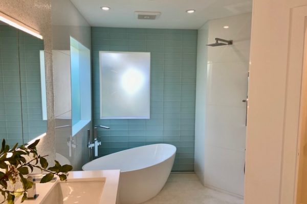 Contemporary Modern Bath featuring floating vanity from Bellmont with shell mosaic backsplash.