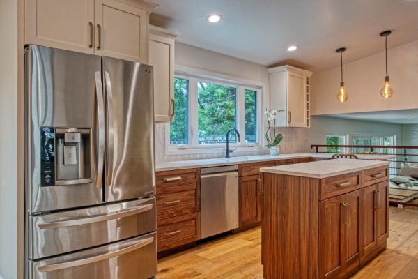 Transitional Kitchen. Back splash Sonoma Tile Makers Stellar Trestle Goose Down color White and Apple. Cabinets by Europa Walnut combines with white to complete the concept. Counter tops Lg Hausys Clarino Brushed finish.