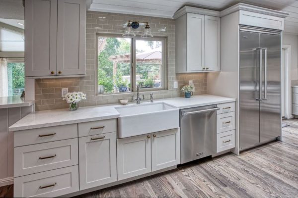 Transitional Kitchen with Sonoma Tile Backsplash cabinets by Dura- Supreme the Island is Knotty Alder Sesame with Cerino gold countertop.