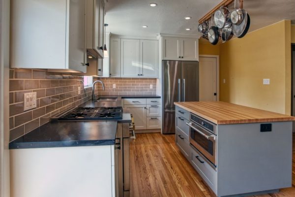 Transitional Kitchen, we enlarged the kitchen space to create a more open area for our Yountville clients Wood-mode painted cabinets were selected to combine with a dark quartz top and Sonoma Tilemakers back splash.